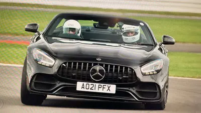 Stephen Whiteley coaching drivers in Mercedes-AMG GT cars, white helmets