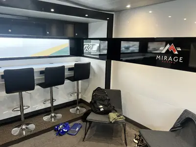 Team pit garage with race cars prepared ahead of a session