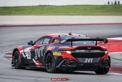 Rear view of the SWR Performance Aston Martin Vantage GT4 race car on track