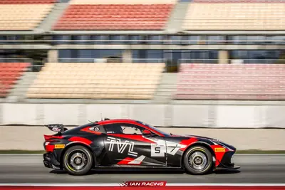 SWR Performance-liveried Aston Martin Vantage GT4 race car at speed, side profile on circuit