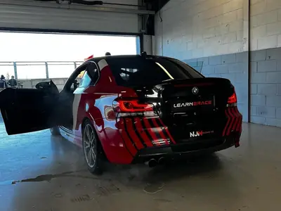 Black BMW 1-Series liveried for Learn2Race coaching