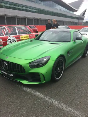 Green Mercedes-AMG GT R parked trackside at Silverstone